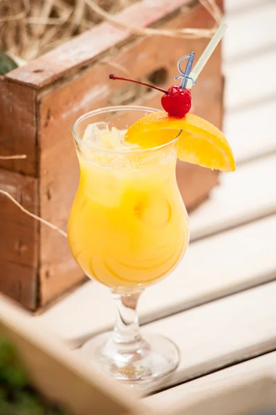 Cocktail orange maraschino cherry and mango — Stock Photo, Image