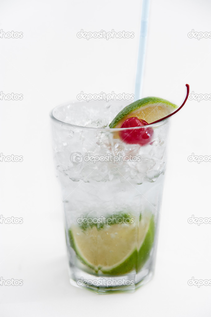 Glass of gin and tonic with ice and lemon