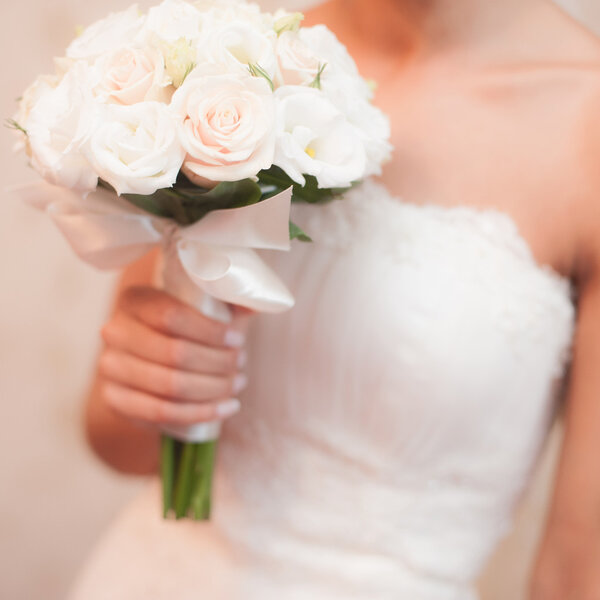 Bride holding weeding bouquet
