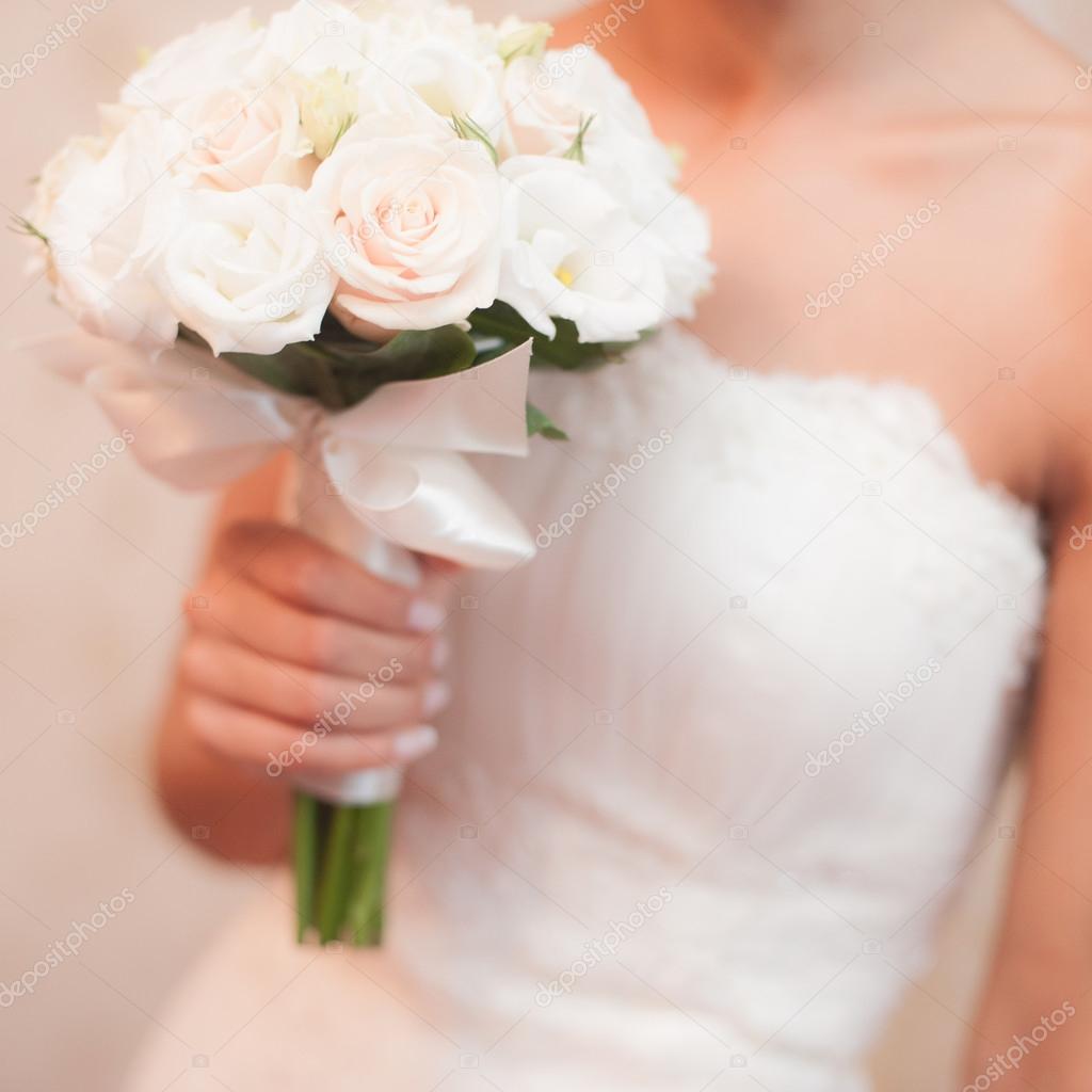 Bride holding weeding bouquet