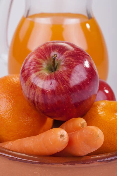 Apple, orange and carrots — Stock Photo, Image