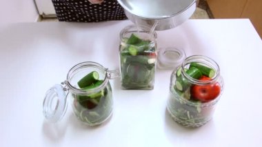 Filling veggies jar with fresh brine solution