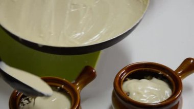 Sauce Mornay into clay pots