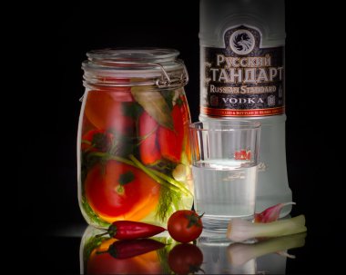 Bottle vodka and marinated tomatoes