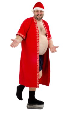 ağırlık ölçekler üzerinde santa ayakta