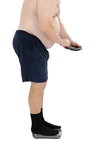 Fat man calculates calories Royalty Free Stock Images