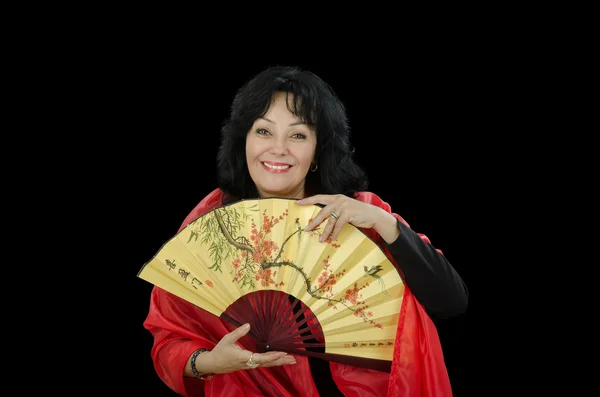 Black haired white woman with fan — Stock Photo, Image
