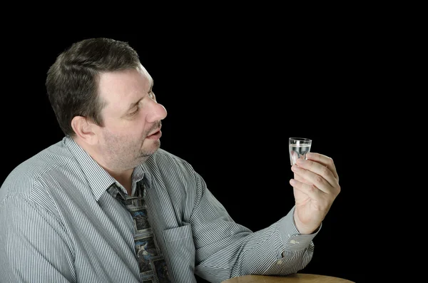 Guy thinks to drink one more vodka shot — Stock Photo, Image