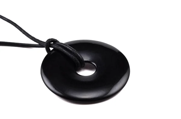 Black agate donut on leather string — Stock Photo, Image