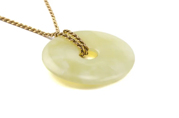 Butter jade stone donut on golden chain — Stock Photo, Image