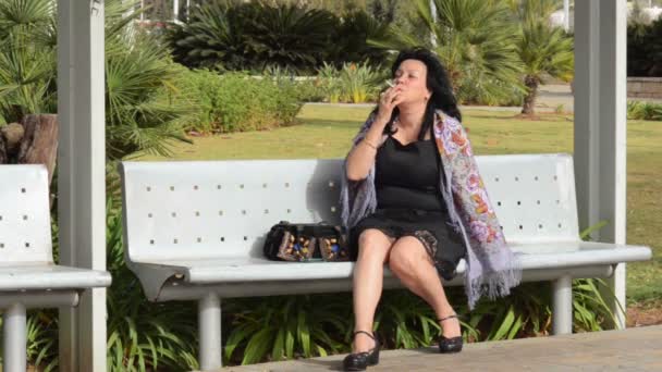 Lonesome mature woman smokes — Stock Video