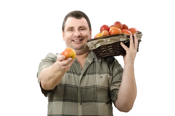 Smiling farmer offering one apple for you — Stock Photo, Image