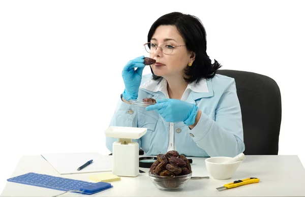 Phytosanitary engineer smelling dates — Stock Photo, Image