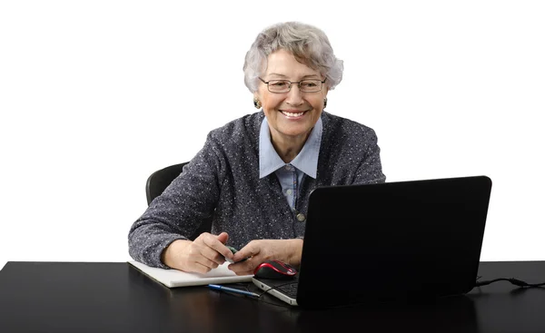 Grey haired old business lady laughing during skype conversation — Stock Photo, Image