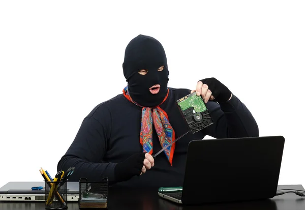Robber holding in one hand a hard drive — Stock Photo, Image