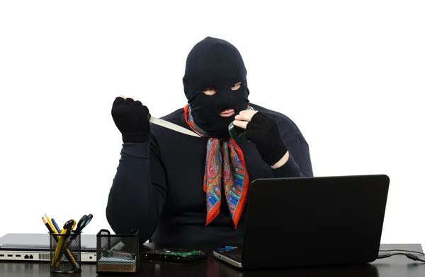 Robber in balaclava with knife talking on the cell phone — Stock Photo, Image