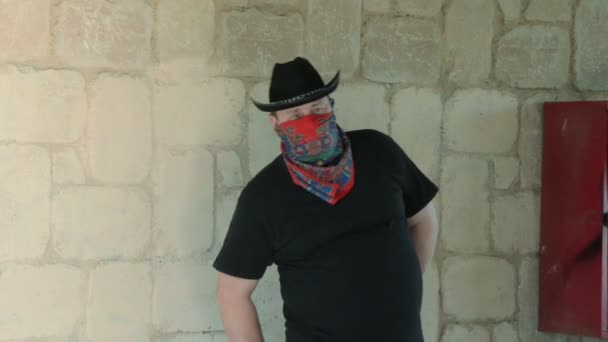 Cowboy in bandana ambushing with knife — Stock Video