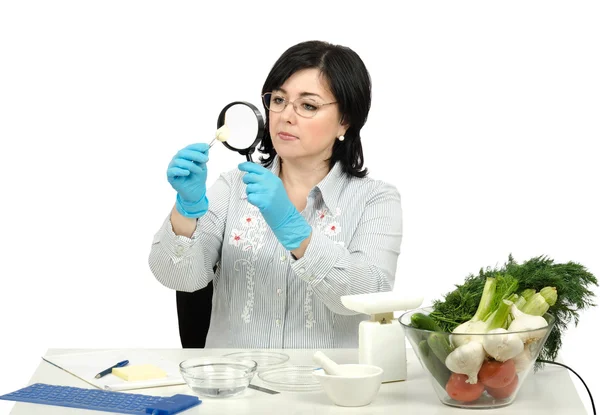 Phytosanitary technician carefully inspecting at a clove of garl — Stock Photo, Image