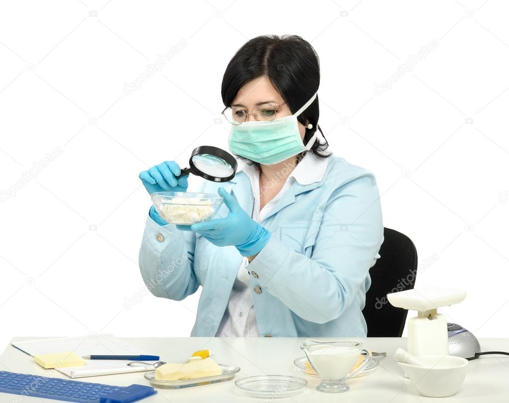 Expert viewing closely a cottage cheese in laboratory
