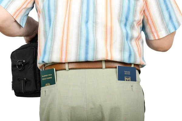 Tourist holding Israeli and Tonga passports in rear pockets — Stock Photo, Image