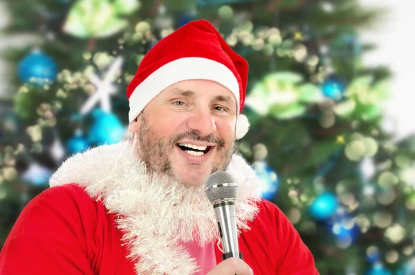 Cheerful Santa singing with microphone — Stock Photo, Image