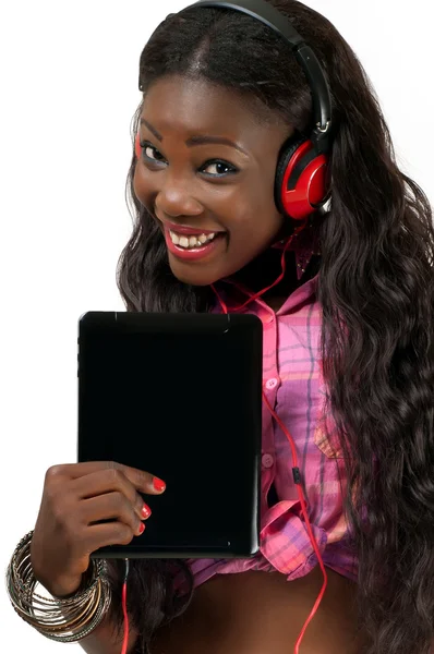 Smiling African American woman listening to music with headphone Stock Picture