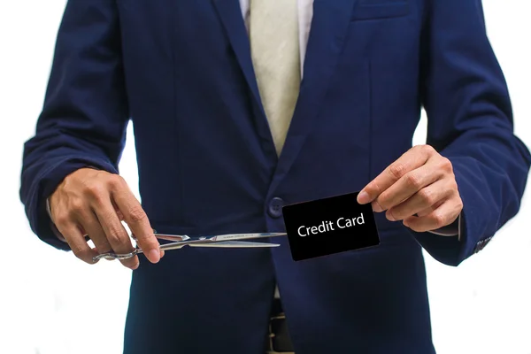 Man cutting money on white — Stock Photo, Image