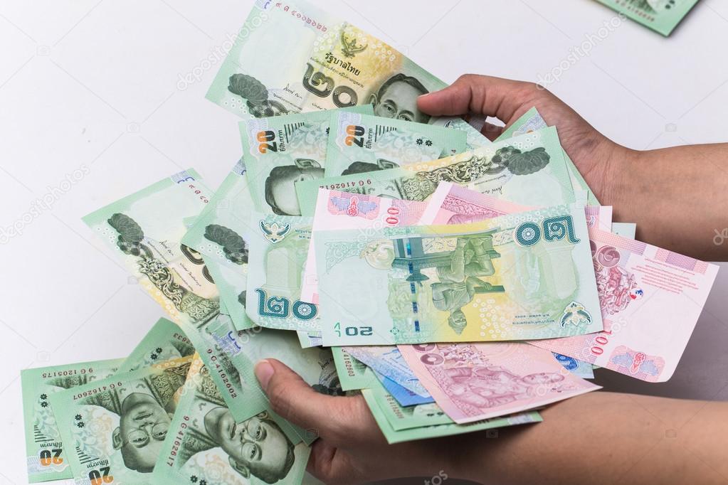 Thai bath close up of money with hand