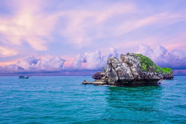 Tropical rock islands, for diving against blue sky