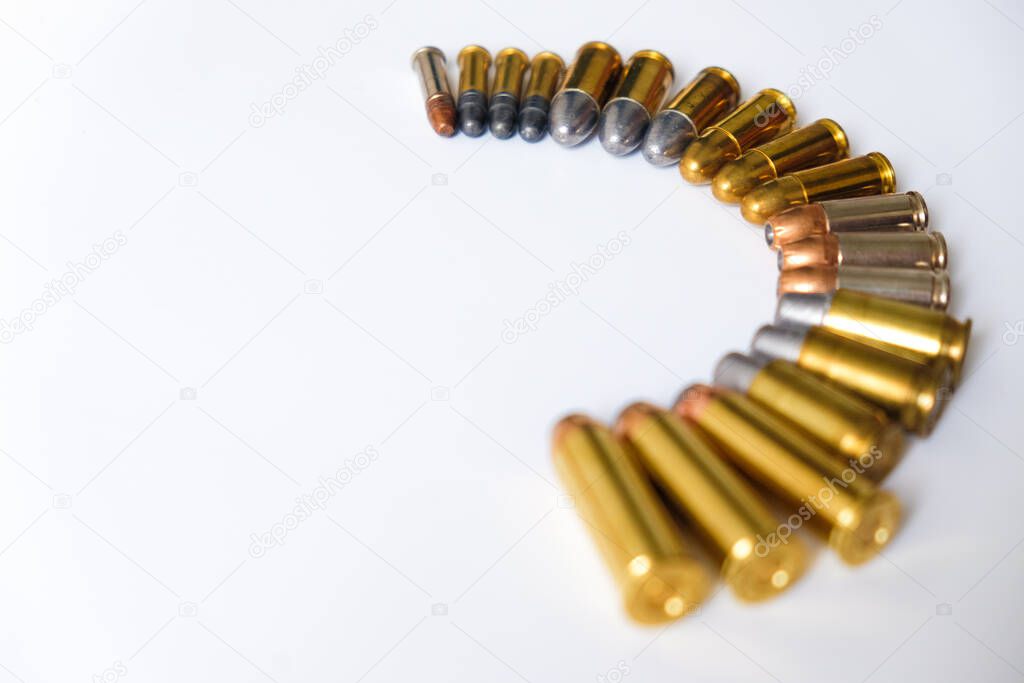 Group of pistol bullet .44 magnum 9mm and .45 on white background criminal concept