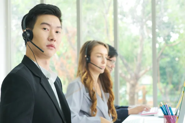 Group of business call center various asian and caucasian nationality multi language operator CC concept