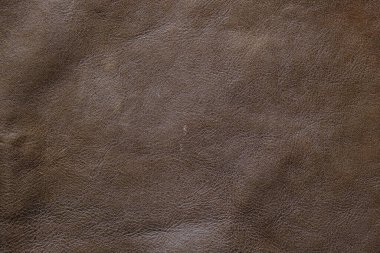 Kahverengi, tam tahıllı, gerçek deri arka plan inek derisi.