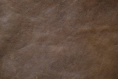 Kahverengi, tam tahıllı, gerçek deri arka plan inek derisi.