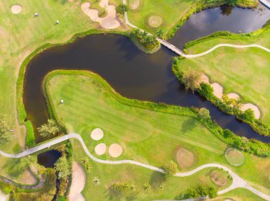Aerial view green grass golf course field with river sport club