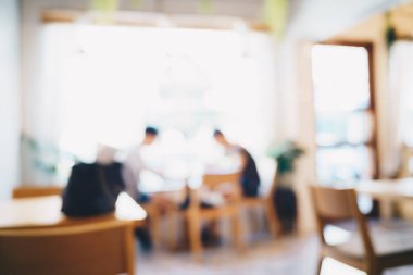 Abstract blurred people sitting in modern city cafe vintage tonned