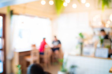Abstract blurred people sitting in modern city cafe vintage tonned