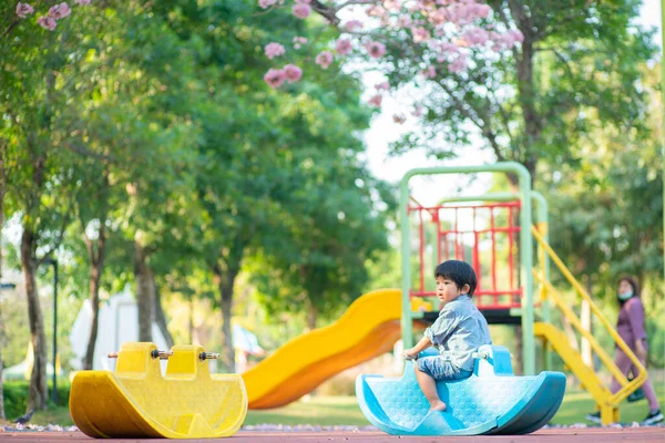 Funny Cute Happy Baby Playing Rocking Horse Flower Tree Playground — Stock Photo, Image