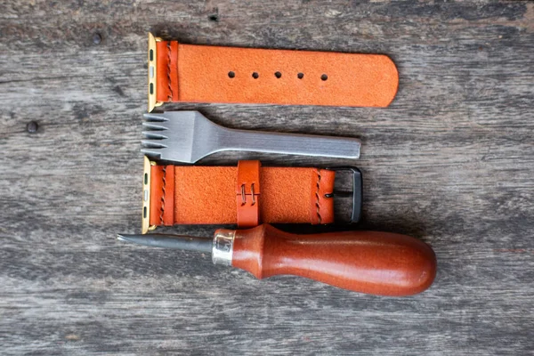 Orange leather smart watch strap hand made on wood craftmanship working