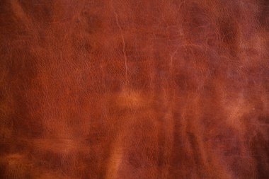 Luxury vintage red brown genuine cow vegetable tanned leather abstract background
