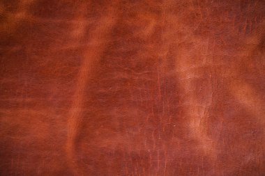 Luxury vintage red brown genuine cow vegetable tanned leather abstract background