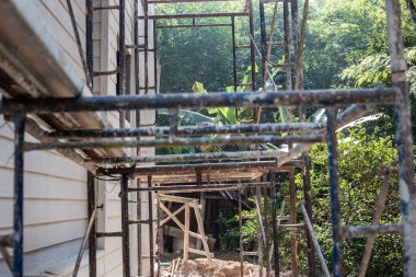 Scaffolding out site of modern new house building civil engineer construction site