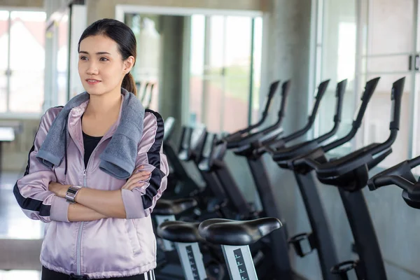 Sport women leisure and drink water after burn running on treadmill Women in gym