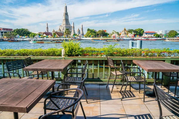 Empty table restaurant bar water front view temple of dawn Wat Pho, Bangkok Thailand