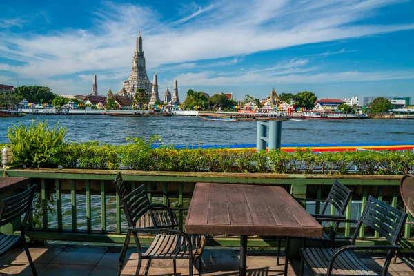 Empty table restaurant bar water front view temple of dawn Wat Pho, Bangkok Thailand