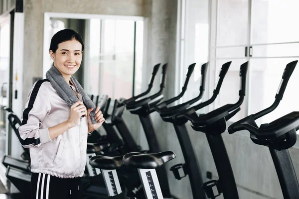 Smiling sport women standing portrait in private gym after working out