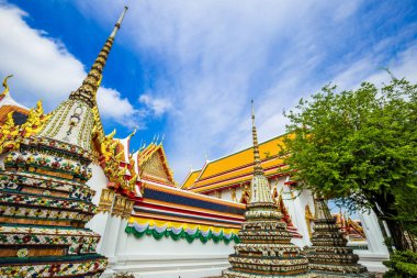 Beautiful pagoda of Wat Pho temple complex against blue sky sightseeing travel in Bangkok, Thailand