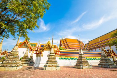 Beautiful pagoda of Wat Pho temple complex against blue sky sightseeing travel in Bangkok, Thailand