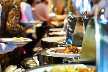 People hand grab buffet food serve in hotel restaurant business food and drink