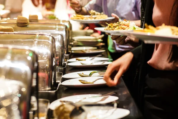 People hand grab buffet food serve in hotel restaurant business food and drink
