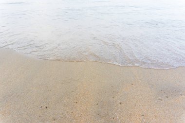 Sea wave on sandy beach morning sun light nature landscape